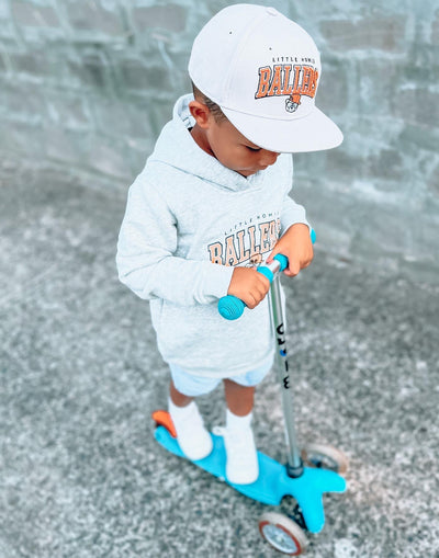 boy riding his aqua mini classic 3 wheel scooter